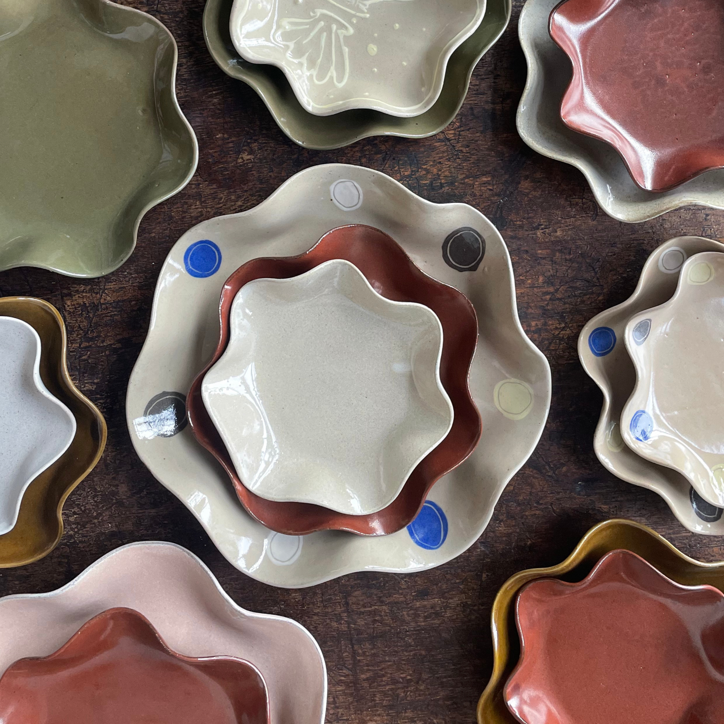 Handmade in London, England. Wavey Ceramics. Plates for gifts, or everyday. Gazed in an array of colours. Perfect for presents. Centrepiece or display plate. Shop online. Porcelain. Patterned. Blue. Cream. White. Green. Set. Drawing.